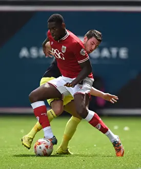 Bristol City V Walsall Prints: Intense Rivalry: Jay Emmanuel-Thomas vs Michael Cain at Ashton Gate