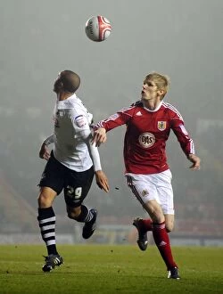 Images Dated 1st February 2011: Intense Rivalry: Keogh vs. Richards Clash in Bristol City vs