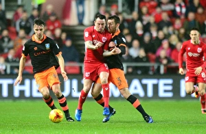 Intense Rivalry: Lee Tomlin vs. David Jones Clash in Bristol City vs. Sheffield Wednesday Sky Bet Championship Match