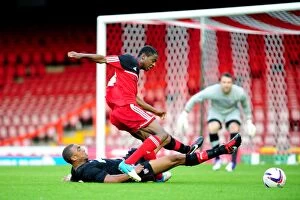 Images Dated 4th September 2012: Intense Rivalry: Legge Stops Karns Goal Attempt in Bristol City U21s vs. Brentford U21s