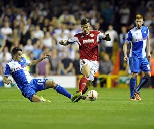 Images Dated 4th September 2013: Intense Rivalry: Marlon Pack vs. Oliver Norburn - The Battle in the Bristol Derby