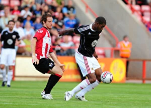 Images Dated 26th July 2010: Intense Rivalry: Marvin Elliott vs. Ryan Harley in a Hard-Fought Battle