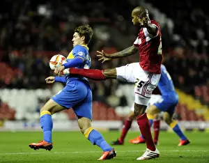Bristol City V Shrewsbury Town Prints: Intense Rivalry: Marvin Elliott vs Tom Bradshaw - Battle for Ball Control at Ashton Gate