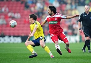 Images Dated 24th March 2012: Intense Rivalry: Neil Kilkenny vs. Merouane Zemmama at Riverside Stadium - Middlesbrough vs