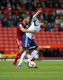 Bristol City V Bolton Wanderers Prints: Intense Rivalry: Nyatanga vs. Ngog - Battle for Ball Possession