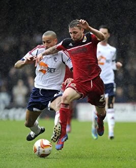 Images Dated 13th April 2013: Intense Rivalry: Paul Anderson vs. Darren Pratley - Battle for Possession in Bristol City vs