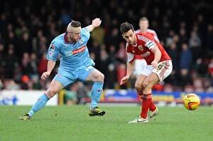 Images Dated 15th February 2014: Intense Rivalry: Sam Baldock vs Jake Cassidy Battle for the Loose Ball in Bristol City vs Tranmere