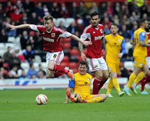 Bristol City V Preston North End Prints: Intense Rivalry: Wade Elliott vs Lee Holmes - A Battle for Supremacy in the Sky Bet League One Clash between Bristol