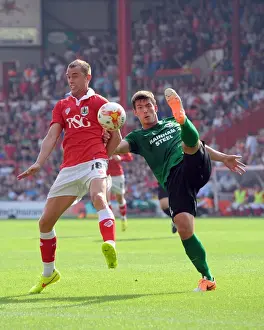 Intense Rivalry: Wilbraham vs Canavan - A Football Battle at Ashton Gate