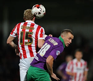 Images Dated 8th October 2014: Intense Rivalry: Wilbraham vs Deaman - The Battle for the Ball in Cheltenham Town vs Bristol City