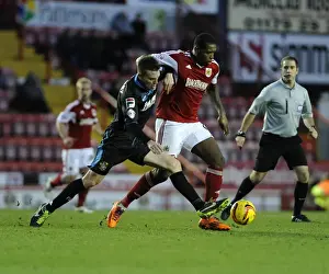 Intense Sky Bet League One Clash: Jay Emmanuel-Thomas Tackled by Opponent at Ashton Gate
