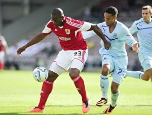 Images Dated 11th August 2013: Intense Sky Bet League One Clash: Marlon Harewood Snatches Ball from Jordan Clarke