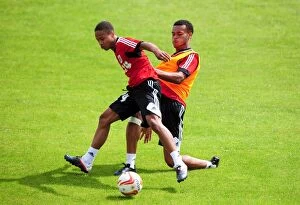 Images Dated 29th July 2012: Intense Training: Bobby Reid vs. Aaron Wilbraham - A Football Showdown at Bristol City