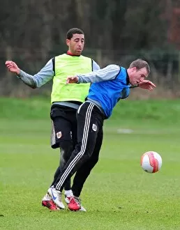 Images Dated 10th January 2012: Intense Training Clash: David Clarkson vs. Lewin Nyatanga, Bristol City Football Club