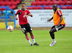 Images Dated 31st July 2012: Intense Training Showdown: Bobby Reid vs. Damion Stewart - A Battle for the Ball