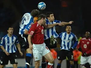 Sheffield Wednesday V Bristol City Prints: Jamie McCombe jumps to compete with the sheffield wednesday defence