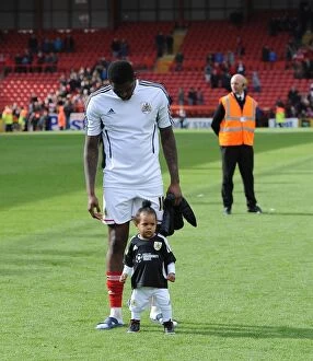 Images Dated 26th April 2014: Jay Emmanuel-Thomas of Bristol City Celebrates with His Child after Securing Promotion to League One