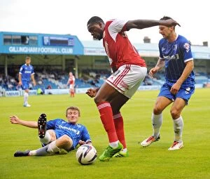 Images Dated 6th August 2013: Jay Emmanuel-Thomas Tackles Gillingham Defense in Capital One Cup Clash