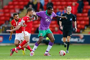 Barnsley V Bristol City Prints: Jay Emmanuel-Thomas vs Barnsley Defense: Intense Moment at Oakwell Stadium, 2014