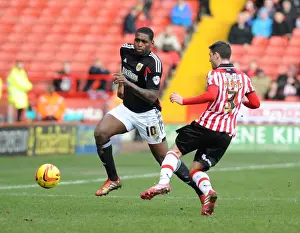 Sheffield United V Bristol City Prints: Jay Emmanuel-Thomas vs Bob Howard: Intense Moment in Sheffield United vs Bristol City Football Match