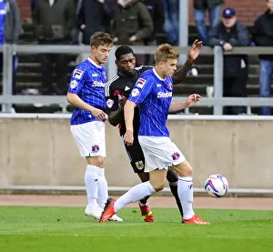 Carlisle United V Bristol City Prints: Jay Emmanuel-Thomas vs Brad Potts: Intense Moment in Carlisle United vs Bristol City Football Match