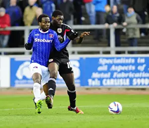 Carlisle United V Bristol City Prints: Jay Emmanuel-Thomas vs. David Symington: Intense Moment in Carlisle United vs