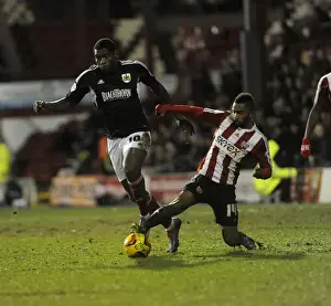 Brentford V Bristol City Prints: Jay Emmanuel-Thomas vs Shaleum Logan: Intense Battle at Griffin Park