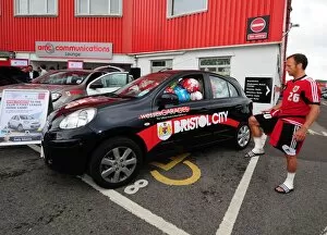 Images Dated 3rd August 2012: Jody Morris Fills Car with Soccer Balls at Bristol City FC Pre-Season Open Day