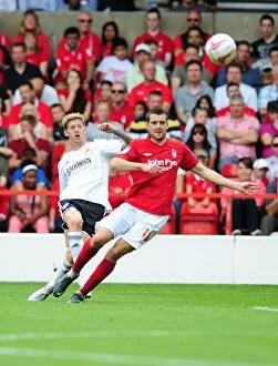Images Dated 18th August 2012: Jon Stead of Bristol City Swings a Corner Kick at Nottingham Forest's The City Ground
