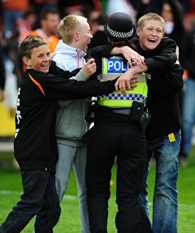Blackpool v Bristol City Collection: Jubilant Blackpool Fans Celebrate Championship Victory with Police