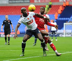 Bolton Wanderers V Bristol City Prints: Kieran Agard Closes In: Intense Moment as Agard Harasses Gouano in Bolton vs