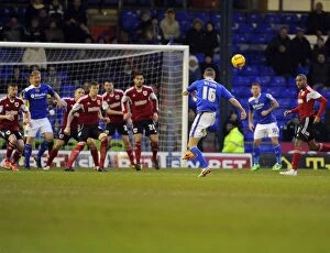 Images Dated 8th February 2014: Late Drama at Boundary Park: Oldham Athletic's James Wilson Scores Wide as Bristol City Push for Win