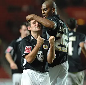 Lee Johnson Celebrates with team mate and midfield partner Marvin Elliott