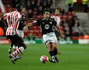 Southampton V Bristol City Prints: Lee Johnson flicks the ball past Bradley Wright-Philips