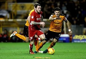 Images Dated 26th December 2016: Lee Tomlin Dashes Past Danny Batth: Wolverhampton Wanderers vs