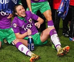 Images Dated 14th April 2015: Luke Ayling's Euphoric Moment: Celebrating Promotion with Bristol City at Bradford City (14.04.2015)