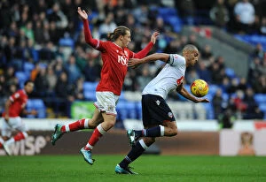 Images Dated 7th November 2015: Luke Freeman Closes In on Darren Pratley: Intense Moment from Bolton Wanderers vs