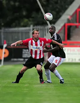 Marcus Stewart battles for the ball with Bristol Citys Kalifa Cisse