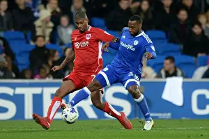 Cardiff City V Bristol City Prints: Mark Little vs. Junior Hoilett: Intense Rivalry at Cardiff City Stadium (Cardiff City v Bristol City)
