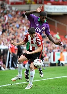 Images Dated 9th August 2014: Mark Little vs. Robert Harris: A Riveting Rivalry Kicks Off Sky Bet League One - Sheffield United