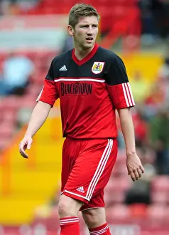 Mark Wilson's Unwavering Determination: Louis Carey's Testimonial Match - Bristol City vs. Bristol Rovers at Ashton Gate Stadium (August 4, 2012)