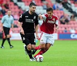 Images Dated 27th July 2013: Marlon Pack of Bristol City Closes In on Bournemouth's Richard Hughes