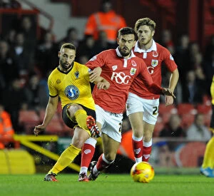 Images Dated 11th November 2014: Marlon Pack of Bristol City Closes In on Sammy Moore of AFC Wimbledon during Johnstone's Paint