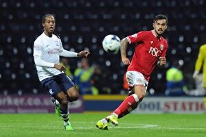Images Dated 15th September 2015: Marlon Pack of Bristol City Playing a Pass Amidst Preston North End's Daniel Johnson - Sky Bet
