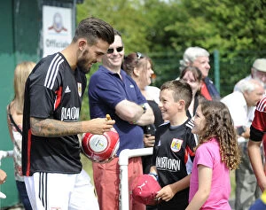 Images Dated 5th July 2014: Marlon Pack of Bristol City Signs Autographs for Young Fans during Portishead Town Pre-Season