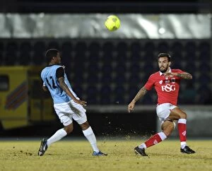 Images Dated 24th July 2014: Marlon Pack Under Pressure: Passing the Ball for Bristol City against Botswana, 2014