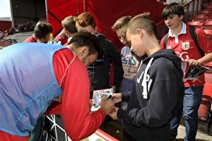 Images Dated 16th August 2014: Marlon Pack Signs Autograph for Ecstatic Fan at Bristol City vs Colchester United Match