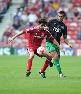 Images Dated 22nd August 2015: Marlon Pack vs Diego Fabbrini: Intense Battle for Ball Possession - Middlesbrough vs Bristol City