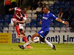 Images Dated 6th August 2013: Maron Harewood's Shot Blocked by Leon Legge in Gillingham vs. Bristol City Football Match, 2013