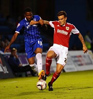 Images Dated 6th August 2013: Maron Pack vs. Antonio German: Battle for the Ball in Gillingham vs. Bristol City (2013)